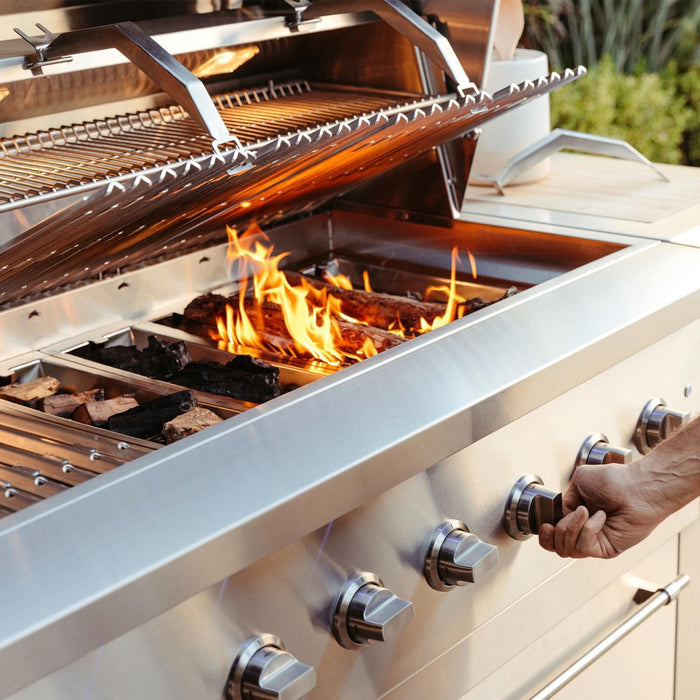 American Made Grills Encore 54-Inch Hybrid Grill in use with open flame grilling and controlling the temperature