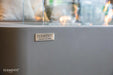 Elementi Sydney ECG01 Space Gray Ethanol Rectangular Fire Pit Table Close up Image on Elementi Logo